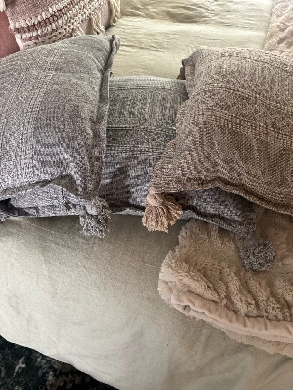 3 square gray pillows